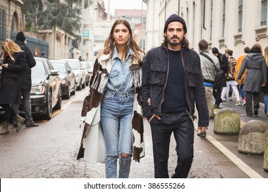 MILAN, ITALY - FEBRUARY 27: Fashionable Couple Walks Outside Ermanno Scervino Fashion Show During Milan Women's Fashion Week On FEBRUARY 27, 2016 In Milan.