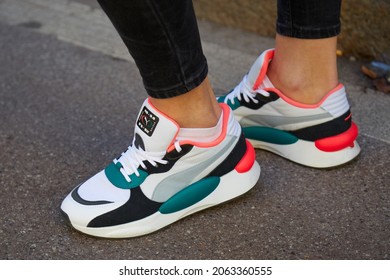 MILAN, ITALY - JANUARY 12, 2019: Woman With White, Green, Pink Puma Sneakers, Street Style 