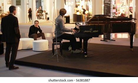 MILAN, ITALY - JANUARY 15: Piano performance during Macef, International Home Show Exhibition January 15, 2010 in Milan, Italy. - Shutterstock ID 56381887
