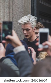 MILAN, ITALY - JANUARY 20: Model Lucky Blue Smith surrounded by fans outside Cavalli fashion show building for Milan Men's Fashion Week on JANUARY 20, 2015 in Milan.