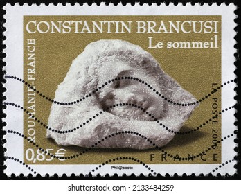Milan, Italy - January 24, 2022: Sculture the sleep by Constatin Brancusi on postage stamp