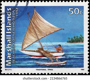 Milan, Italy - January 24, 2022: Traditional Polynesian Sailing Boat On Postage Stamp