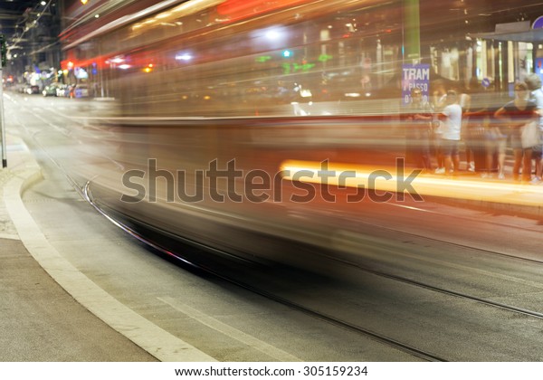MILAN, ITALY - JULY 21: summer night view of a\
typical public tram in Milan city. Long exposure with blurred\
motion panning. Milan, July 21,\
2015.