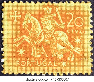 Milan, Italy - July 22, 2016: Knight on vintage portuguese postage stamp