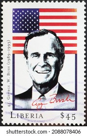 Milan, Italy - July 27, 2018: President George W. Bush And Flag On Postage Stamp