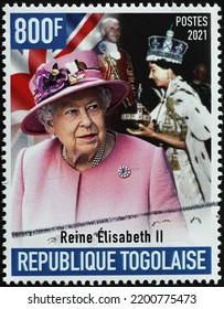 Milan, Italy . July 27, 2021: Queen Elizabeth II At Her Coronation And Nowadays On Stamp