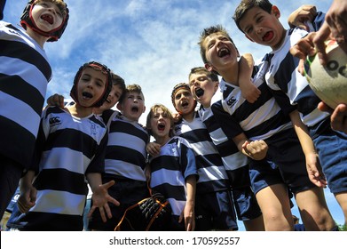 MILAN, ITALY - JUNE 02: children rugby team during "Rugby in the park", in Milan, June 02, 2013. Pubblic event to let children approach this sport.