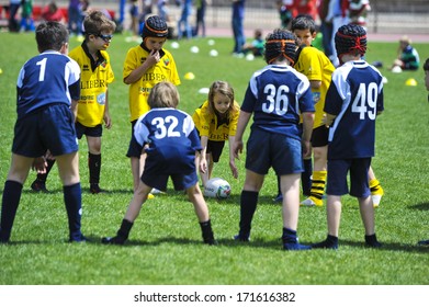 MILAN, ITALY - JUNE 02: Children playing rugby during a school camp at the Arena in Milan. June 02, 2013.