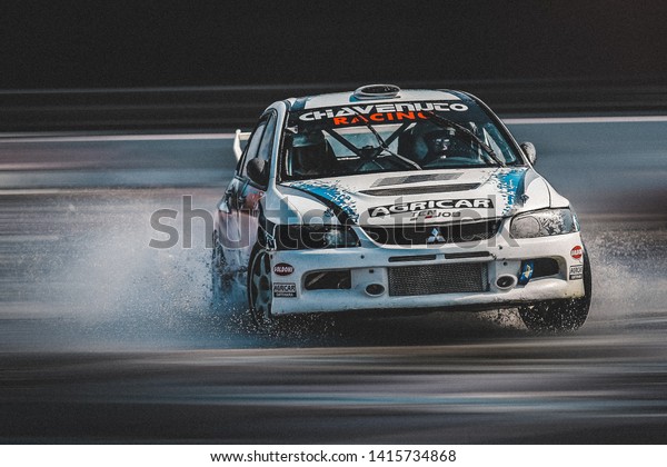 Milan, Italy, June 03, 2018: Mitsubishi Lancer\
Evolution in action during the 1st Drift Show Il Destriero at the\
Iper Drive in Milan.