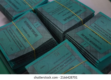 Milan, Italy, June 11, 2022: packet of green  ballot papers for the referendum on justice of June 12, 2022. Written: "Popular referendum of the Province of Milan, ballot paper".