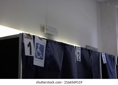 Milan, Italy - June 12, 2022: Italian Election Day Of June 12, 2022, Five Italian Referendums On The Judicial System. A Hand Inserts A Ballot Into The Ballot Box