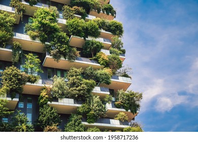 Milan, Italy - June 15, 2019: Green futuristic skyscraper Bosco Verticale, vertical forest apartment building with gardens on balconies. Modern sustainable architecture in Porta Nuova district.