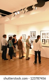 MILAN, ITALY - JUNE 16: People Look At Phil Stern Photos Exhibition Opening At Forma Photography Foundation June 16, 2010 In Milan, Italy.