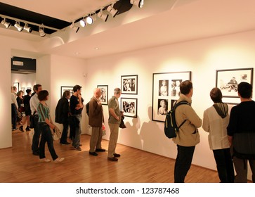 MILAN, ITALY - JUNE 16: People Look At Phil Stern Photos Exhibition Opening At Forma Photography Foundation June 16, 2010 In Milan, Italy.