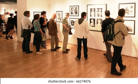 MILAN, ITALY - JUNE 16: People Looking At Phil Stern Photograhy Exhibition At Forma Photography Foundation June 16, 2010 In Milan, Italy.