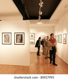 MILAN, ITALY - JUNE 16: People Look At Phil Stern Photos Exhibition At Forma Photography Foundation June 16, 2010 In Milan, Italy.