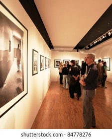 MILAN, ITALY - JUNE 16: People Look At Phil Stern Photos Exhibition Opening At Forma Photography Foundation June 16, 2010 In Milan, Italy.