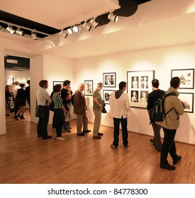 MILAN, ITALY - JUNE 16: People Look At Phil Stern Photos Exhibition Opening At Forma Photography Foundation June 16, 2010 In Milan, Italy.