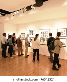 MILAN, ITALY - JUNE 16: People Look At Phil Stern Photos Exhibition Opening At Forma Photography Foundation June 16, 2010 In Milan, Italy.