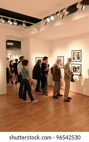 MILAN, ITALY - JUNE 16: People Look At Phil Stern Photos Exhibition Opening At Forma Photography Foundation June 16, 2010 In Milan, Italy.