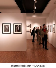 MILAN, ITALY - JUNE 16: People Look At Phil Stern Photos During Exhibition Opening At Forma Photography Foundation June 16, 2010 In Milan, Italy.