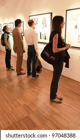 MILAN, ITALY - JUNE 16: People Look At Phil Stern Photos During Exhibition Opening At Forma Photography Foundation June 16, 2010 In Milan, Italy.