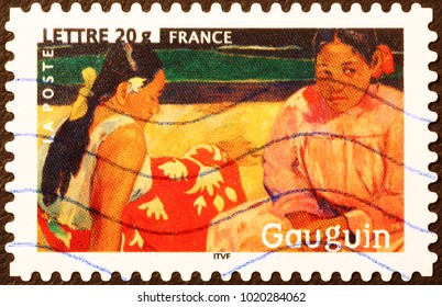 Milan, Italy - June 18, 2016: Painting of two women by Gauguin on postage stamp - 1A5A2222