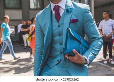 MILAN, ITALY - JUNE 20: People Gather Outside Armani Fashion Show Building For Milan Men's Fashion Week On JUNE 20, 2015 In Milan.