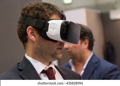 MILAN, ITALY - JUNE 7, 2016: Man Tries Virtual Reality Headset At Technology Hub, International Event For Innovative And Futuristic Technologies Serving Business.