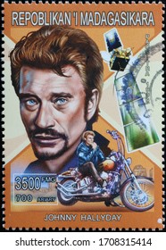 Milan, Italy - March 25, 2020: French Actor Johnny Hallyday On Postage Stamp