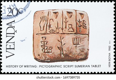 
Milan, Italy - March 26, 2020: Pictographic Script Of Sumerian Tablet On Postage Stamp
