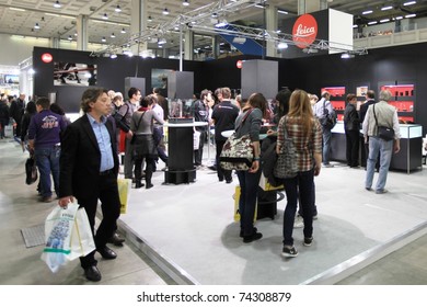 MILAN, ITALY - MARCH 26: People at Leica stand look for new cameras, lenses and accessories during PHOTOSHOW, International Photo and Digital Imaging Exhibition on March 26, 2011 in Milan, Italy.