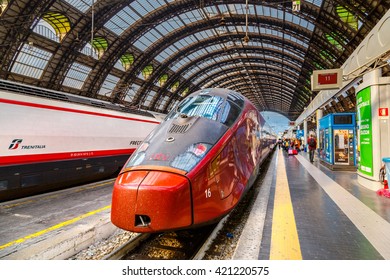 MILAN, ITALY - MAY 01, 2016: Trenitalia Frecciarossa (red arrow) on Milan Central Station. This high speed train can reach 300 km/h and operate Turin-Milan-Bologna-Florence-Rome-Naples route.