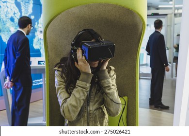 MILAN, ITALY - MAY 1: Woman Tries Virtual Reality Headset At Expo, Universal Exposition On The Theme Of Food On MAY 1, 2015 In Milan.