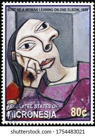 Milan, Italy - May 18, 2020: Bust of a woman by Pablo Picasso on postage stamp