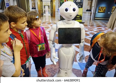 Milan, Italy - May 22, 2017: A Group Of Children Together With A Pepper Robot