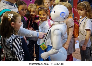 Milan, Italy - May 22, 2017: A Group Of Children Together With A Pepper Robot