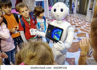 Milan, Italy - May 22, 2017: A Group Of Children Together With A Pepper Robot