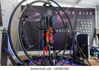 MILAN, ITALY - MAY 24: Girl tries virtual reality space dive machine at Wired Next Fest, event dedicated to future, innovation and creativity on MAY 24, 2019 in Milan.