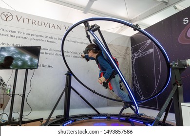 MILAN, ITALY - MAY 24: Girl tries virtual reality space dive machine at Wired Next Fest, event dedicated to future, innovation and creativity on MAY 24, 2019 in Milan.