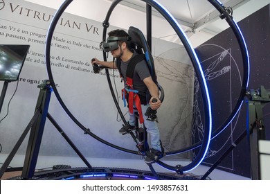 MILAN, ITALY - MAY 24: Guy tries virtual reality space dive machine at Wired Next Fest, event dedicated to future, innovation and creativity on MAY 24, 2019 in Milan.