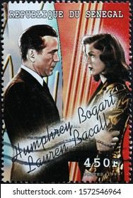 Milan, Italy - November 09, 2019: Humphrey Bogart and Lauren Bacall on postage stamp