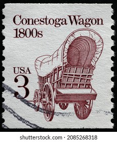 Milan, Italy - November 10, 2021: Conestoga wagon on vintage american postage stamp