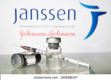 Milan, Italy: November 16, 2020: Vaccine vials and syringe with Janssen Pharmaceutical logo. Big Pharma companies are racing to complete clinical trials for a vaccine to fight the coronavirus Covid19