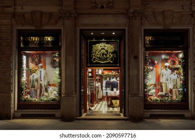 Milan Italy November 17 2021: Gutteridge Store Exterior With Logo And Christmas Decoration. Italian Fashion Brand Creating Clothes And Accessories For Men Window Showcase View.