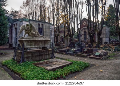 Milan, Italy - November 17 2021: Monumental Cemetery with artistic tombs and monuments. Cimitero Monumentale burial ground with funerary sculptures and temples.