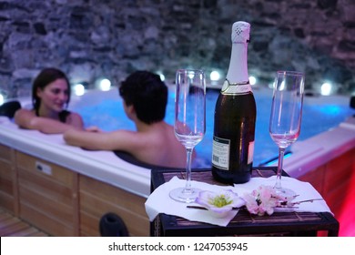 Milan, Italy - november 2018: Beautiful young couple relaxing together in the Whirlpool