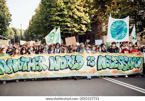 Milan, Italy - October 2 2021: People protesting against global warming and climate change in fridays for future strike after Youth4Climate Milan COP26