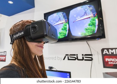 MILAN, ITALY - OCTOBER 24: Girl tries Oculus headset at Games Week 2014, event dedicated to video games and electronic entertainment on OCTOBER 24, 2014 in Milan.