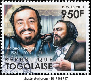 Milan, Italy - October 28, 2020: Tenor Luciano Pavarotti On Postage Stamp